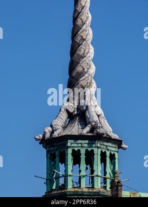 Copenhagen, Denmark - July, 2021: Spire, shaped as the tails of four dragons twined together, reaching a height of 56 metres on the Børsen -17th-centu Stock Photo