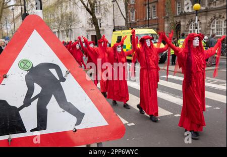 London, UK . 22nd Apr, 2023. 'Red Rebels Brigade' at Extinction Rebellion, The Big one, day 2 ,( saturday). Involved the 'Big One march for biodiversity'which ended with a 'die in'. Members of the 'Red Rebel Brigade 'and 'Green spirits' attended, 22 April 2023.London United KIngdom Picture garyroberts/worldwidefeatures.com Credit: GaryRobertsphotography/Alamy Live News Credit: GaryRobertsphotography/Alamy Live News Stock Photo