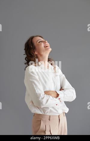 Studio portrait of mature woman laughing Stock Photo - Alamy