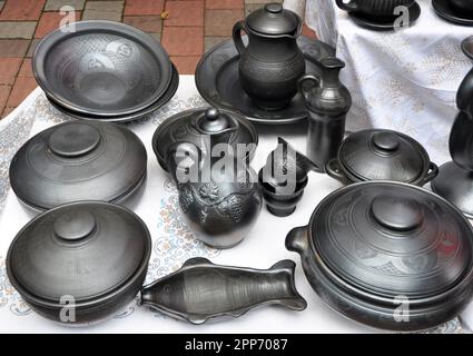 A variety of pottery made by folk craftsmen from clay. Stock Photo