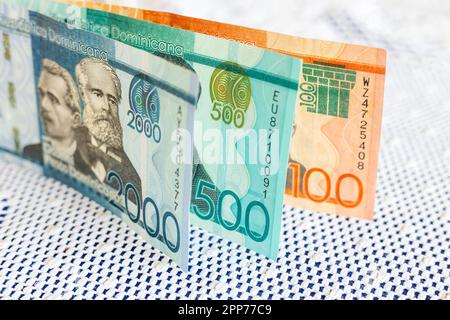 Dominican Republic money, Pesos banknotes on white tablecloth at home, Household expenses and family budget concept Stock Photo