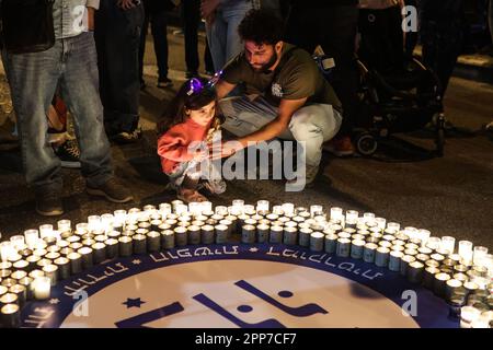 Tel Aviv, Israel. 22nd Apr, 2023. Demonstrators light candles during a protest against the Israeli right-wing government. Credit: Ilia Yefimovich/dpa/Alamy Live News Stock Photo