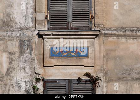A small mosaic on the façade of an old house Stock Photo