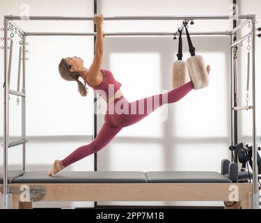 Premium Photo  Woman in pink sport clothing standing on pilates