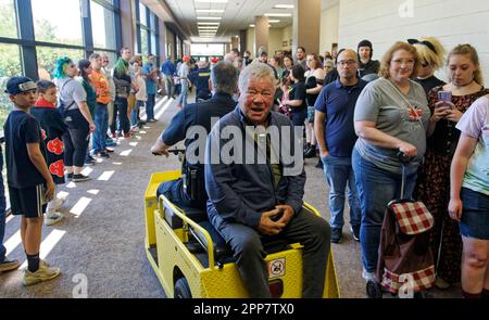 Huntsville, Alabama, USA. 22 Apr 2023. Star Trek actor William Shatner (center) is whisked away by security after speaking on the second day of the 2023 Huntsville Comic & Pop Culture Expo on Saturday, April 22, 2023 at the Von Braun Center in Huntsville, Madison County, AL, USA. The Canadian actor and author, 92, is perhaps best known for his portrayal of Capt. James Tiberius Kirk in the original Star Trek television series and subsequent movies. (Credit: Billy Suratt/Apex MediaWire via Alamy Live News) Stock Photo