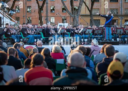 Spectators attend the concert of the Italian army band conducted by Sergeant Major Pasquale Casertano. Figures from all over the world united by their passion for the world of ancient Rome have set up an ancient village at the Circus Maximus to celebrate the 2776th anniversary of the foundation of Rome. The event organized by the Gruppo Storico Romano, a non-profit cultural association born in 1994 from a passion for ancient Rome, this year sees the participation of 2500 re-enactors belonging to 80 associations from 16 nations. The largest number of re-enactors come from Spain. The day ends wi Stock Photo