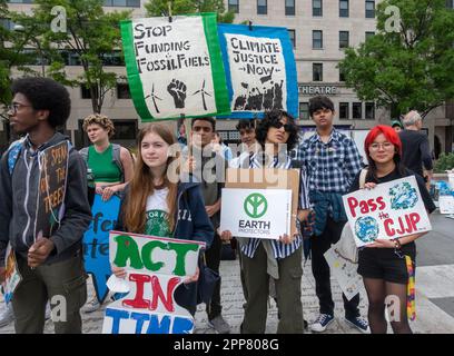 Earth Day rally, Washington, DC Apr. 22, 2023. With US Capitol in distance, people listen to speakers at End the Era of Fossil Fuels Earth Day rally at Freedom Plaza before marching to the White House to demand President Biden do more to end the reliance on climate-changing fossil fuels. Stock Photo