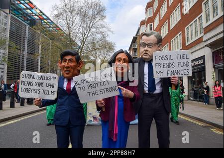 People wearing Rishi Sunak and Suella Braverman masks at the Extinction ...