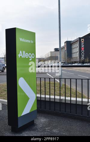 Sign at the Allego fast-charging hub A5 at Stadium MK, Milton Keynes: 'Welcome to Allego'. Stock Photo