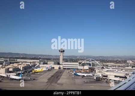 The airport control tower is a tall structure where air traffic controllers monitor the movement of airplanes on the ground and in the air to ensure s Stock Photo