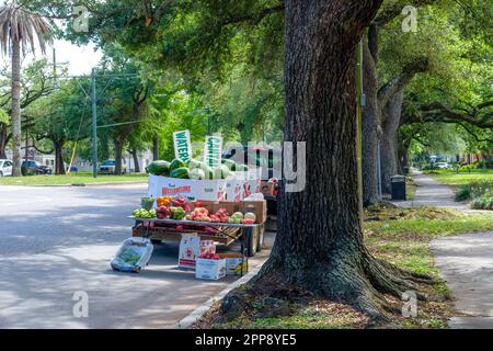 NEW ORLEANS, LA, USA - APRIL 10, 2023: Fruit and vegetable vendor's display on the side of the road next to Marsalis Harmony Park on North Carrollton Stock Photo