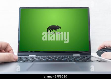 Laptop computer displaying logo of The openSUSE Project, a worldwide effort that promotes the use of Free and Open Source Software. Barnaul. Russia Ma Stock Photo