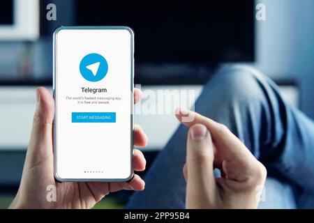 a man is holding a smartphone with a telegram application in his hand. Barnaul. Russia October 20, 2019 Stock Photo