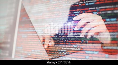 Close up of woman hands typing on laptop keyboard with program code Stock Photo