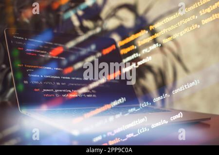 Programming code on the laptop screen. Notebook Stock Photo