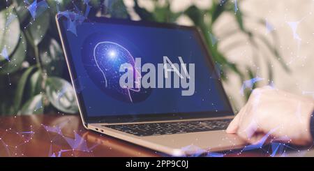 Man using Laptop or Smartphone With AI, Artificial Stock Photo