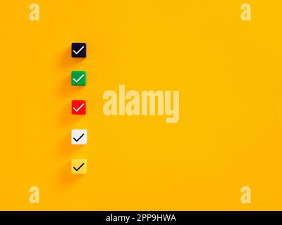 Checklist, questionnaire, to do list or business planning concept. Check mark or tick symbols on white cubes. Stock Photo