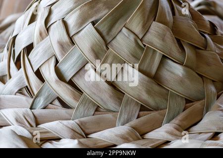 Palm leaf hat closeup, weave, texture,  natural material. Stock Photo