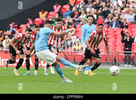 Manchester City's Riyad Mahrez scores from penalty spot during The FA Cup - Semi-Final soccer match between Manchester City against Sheffield United a Stock Photo