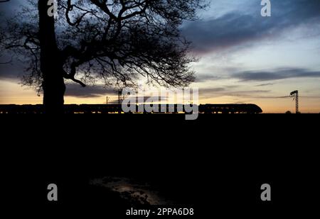 First Transpennine Express CAF class 397 Nova 2 train on the west coast mainline at sunset Stock Photo