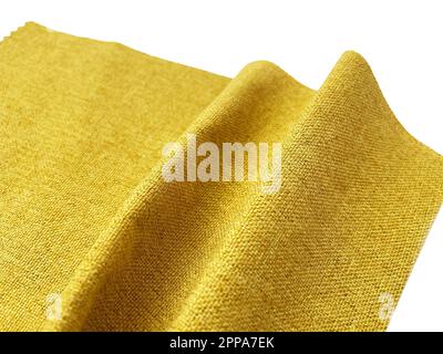 A close-up shot of a yellow fabric on a white background Stock Photo