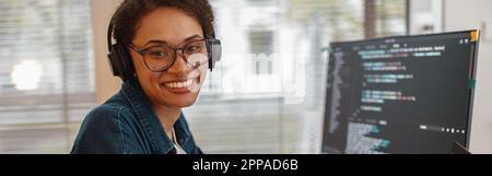 Afro american woman in headphones freelance data scientist work remotely at home office Stock Photo