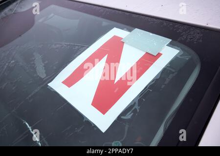 red novice or new driver plates shown in the windscreen of a car in county donegal republic of ireland Stock Photo