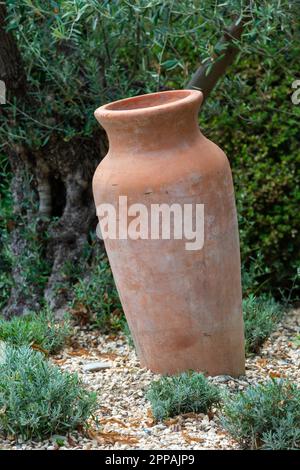 Decorative antique Amphora in the garden Stock Photo