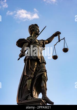 Justitia (Lady Justice) sculpture on the Roemerberg square in Frankfurt, built 1887 Stock Photo