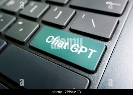 ChatGPT on the keyboard button for Chat with AI or Artificial Intelligence. smart AI or artificial intelligence using an artificial intelligence chatb Stock Photo