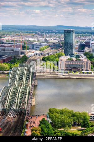 COLOGNE, GERMANY - MAY 12: Hohenzollern bridge in Cologne, Germany on May 12, 2019. View to Triangle tower Stock Photo