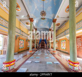 Interior of the Cao Dai temple in Hoi An, Quang Nam province, Vietnam. Cao Dai is a monotheistic syncretic religion that retains many Vietnamese folk Stock Photo