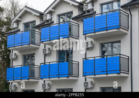 Air conditioner compressor units installed outside of a building Stock ...