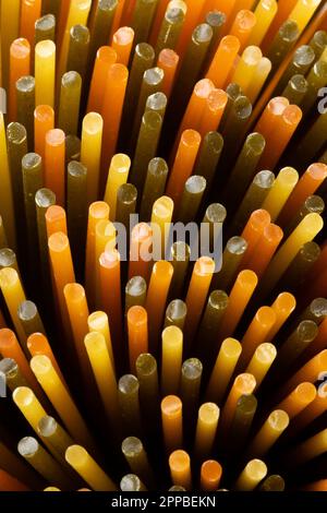 Spaghetti tricolore seen from above close up full frame as background Stock Photo