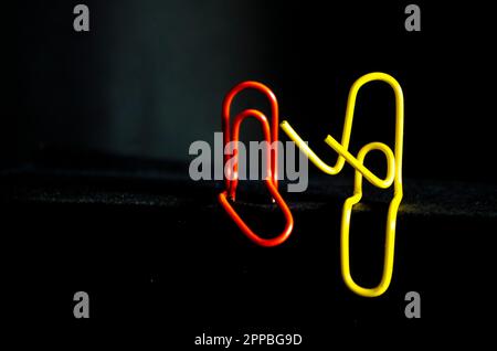 Discussion between two Paper Clips. Stock Photo