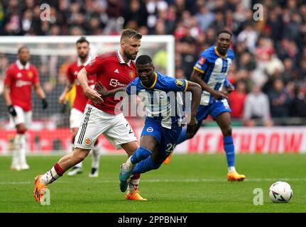 Manchester United's Luke Shaw fouls Brighton and Hove Albion's Moises Caicedo during the Emirates FA Cup semi-final match at Wembley Stadium, London. Picture date: Sunday April 23, 2023. Stock Photo