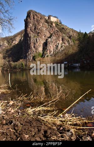 Bad Munster, Germany - February 25, 2021: Castle on top of a rock formation, part of Rotenfels, above the Nahe River on a sunny winter day in Germany. Stock Photo