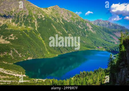 Beautiful blue lake in the polish mountains. Morskie Oko (Sea Eye) Lake is the most popular place in High Tatra Mountains, Poland. Stock Photo