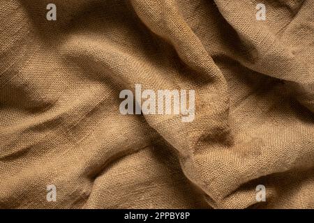 old brown burlap as background close up Stock Photo