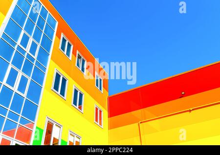 New bright colorful apartment building against a blue sky Stock Photo
