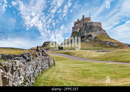 View of Lindisfarne Castle on hill, Holy Island of Lindisfarne, Northumberland, England, UK Stock Photo