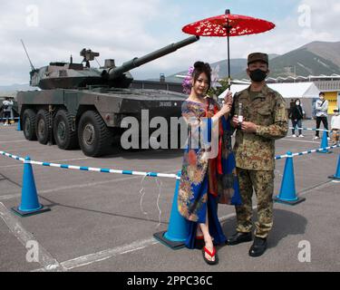 Oyama, Japan. 23rd Apr, 2023. Member of Japan Ground Self-Defense Force and model pose for camera during the 'Motor Fan Festa 2023' at Fuji Speedway in Shizuoka-Prefecture, Japan on Sunday, April 23, 2023. Photo by Keizo Mori/UPI Credit: UPI/Alamy Live News Stock Photo
