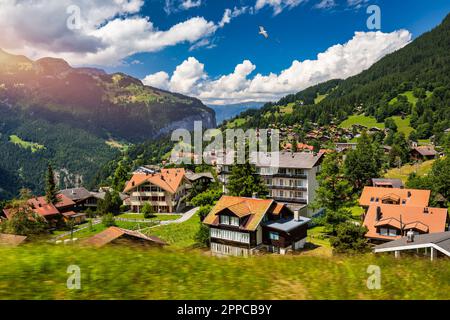 Townscape of village of Wengen on the edge of Lauterbrunnen Valley. Traditional local houses in Wengen village in the Interlaken district in the Bern Stock Photo