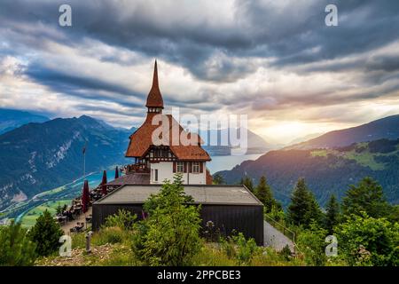 Beautiful top of Harder Kulm in Swiss Interlaken in summer sunset. Turquoise Lake Thun and Brienz in background. Stunning scenery on top of Harder Kul Stock Photo