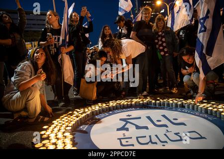 Israel. 22nd Apr, 2023. Protestors against the legal overhaul light candles in memory of the Israeli fallen soldiers and terror victims during a demonstration in Tel Aviv. Apr 22th 2023. (Matan Golan/Sipa USA). Credit: Sipa USA/Alamy Live News Stock Photo