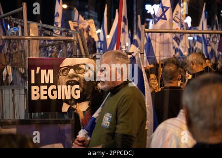 Israel. 22nd Apr, 2023. Protestors againstthe judicial overhaul wave the Israeli flag next to a sign with Menachem Begin's photo during a demonstration in Tel Aviv. Apr 22th 2023. (Matan Golan/Sipa USA). Credit: Sipa USA/Alamy Live News Stock Photo