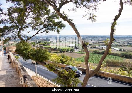 Rabat, Malta - November 13, 2022: View on fields surrounding the town and the road Stock Photo