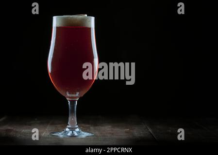 Delicious home brewed beer in a beer glass. Stock Photo