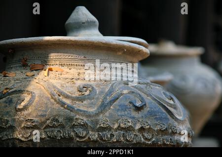 Old Thai traditional stone vase on outdoors ground. Stock Photo