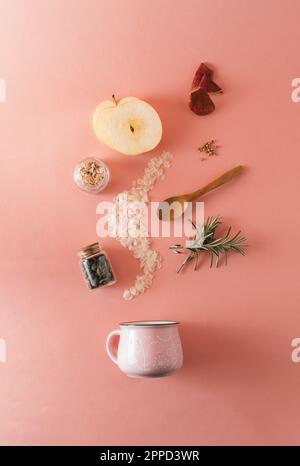 Creative food layout with fruits, vegetables and leaves on bright marble table background with tea cup. Minimal healthy food and drink concept. Flat l Stock Photo